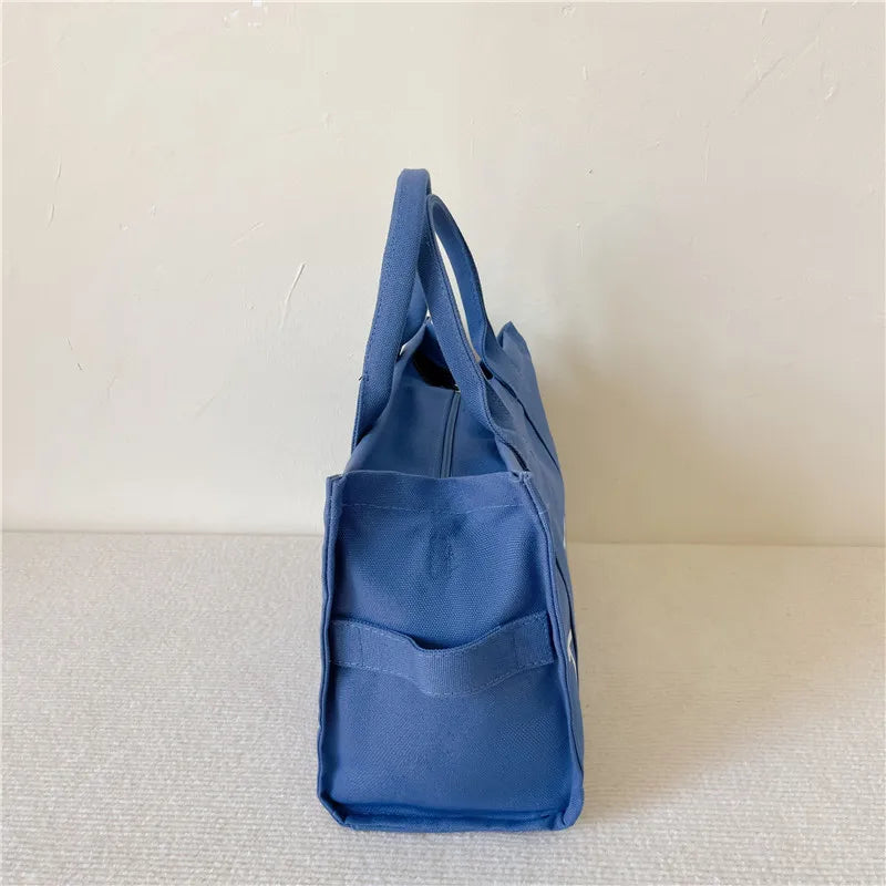 The London Tote – Classic Canvas - Urban style with personality. Spacious, lightweight, and perfect for busy routines.